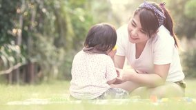 4k Asian baby girl playing blocks with her mom filter colour