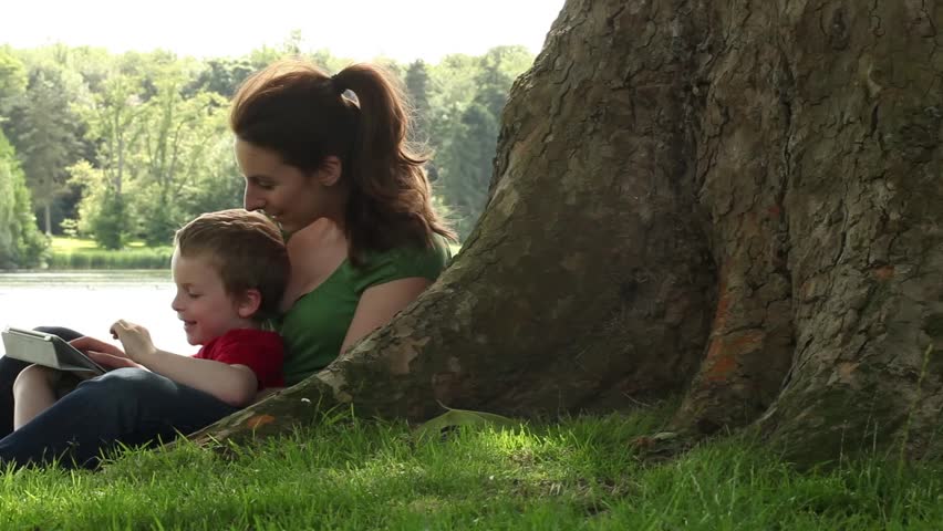 Mum and son playing in the park