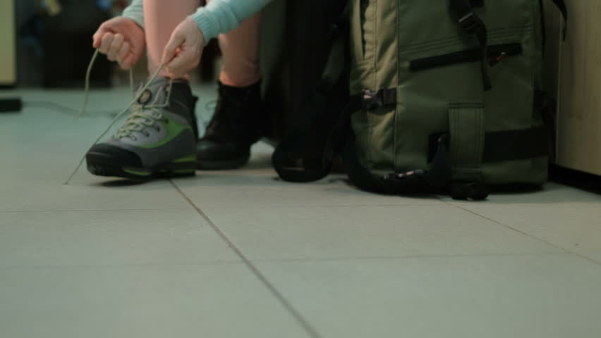 Girl buys buying shoes for travel in the store