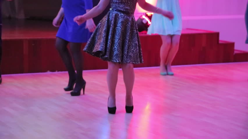 Beautiful female feet dancing on the dance floor