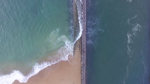 Fly over the pier, walk on the port of Capbreton, France. Flight above the boat access on a winter day, DEC 2016