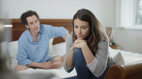 4K Couple with relationship problems having emotional conversation in bedroom