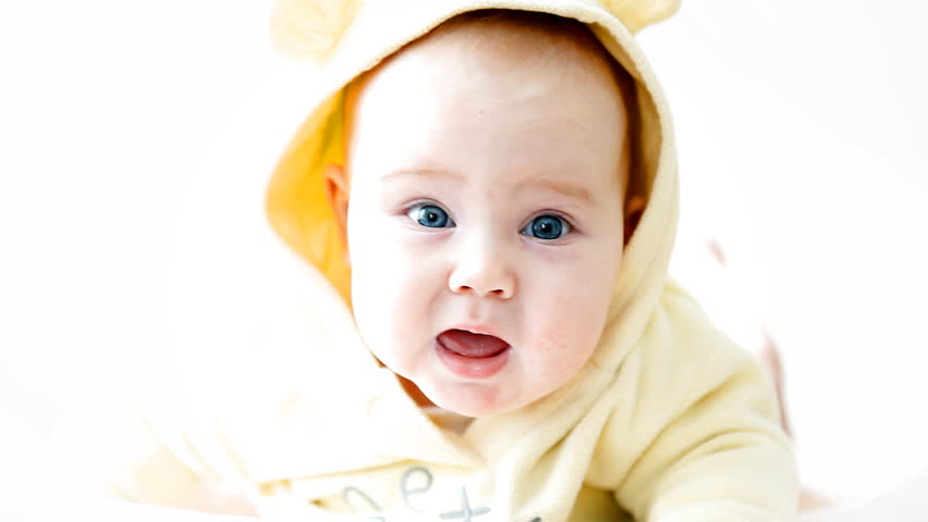 Smiling baby on the light background