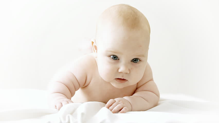 Smiling baby on the light background