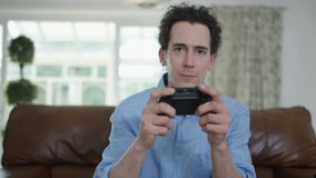 4K Competitive man playing video games at home, as seen from screen's pov