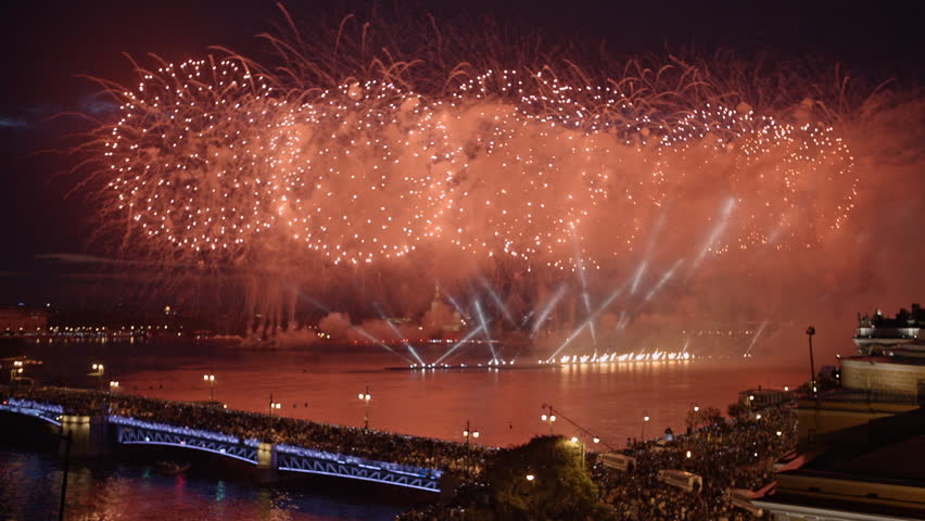 A fantastic fireworks reflecting in a river with smoke and lot of light