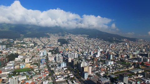 Aerial view of cityscape of Quito, modern capital city of Ecuador from above, Andes mountains on background