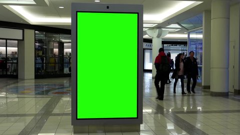 Burnaby, BC, Canada - March 07, 2017 : Motion of people shopping and green sreen billboard in the middle inside Burnaby shopping mall with 4k resolution