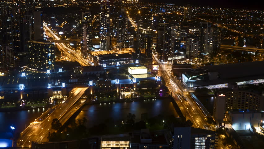 Full HD Time lapse Night scene at Melbourne CBD with motion blur traffic light trail. Pan right