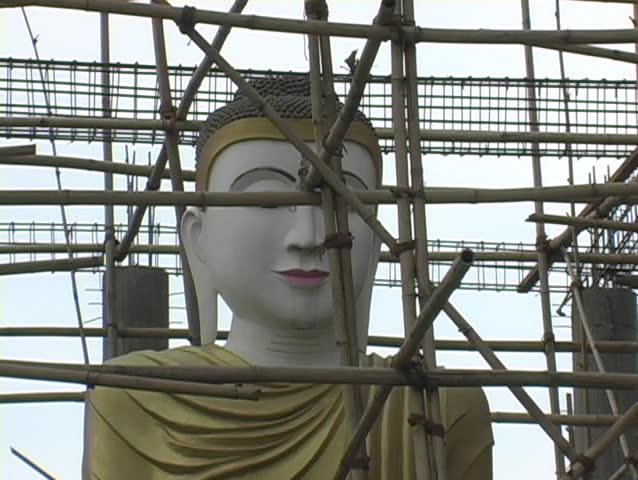 People fixing or making an image to worship.