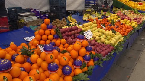 Pendik, Istanbul, Turkey - 17th of February, 2017:  4K Arranging fruits counter on the market
