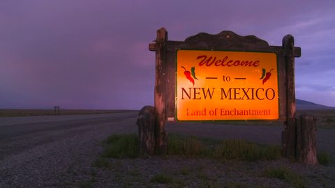HIGHWAY 285, N.M. - CIRCA 2010 - A roadside sign on Highway 285 at the border with Colorado welcomes visitors to New Mexico.