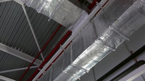 Air ducts for conditioning and ventilation & fire extinguishing pipes at an industrial facility.
