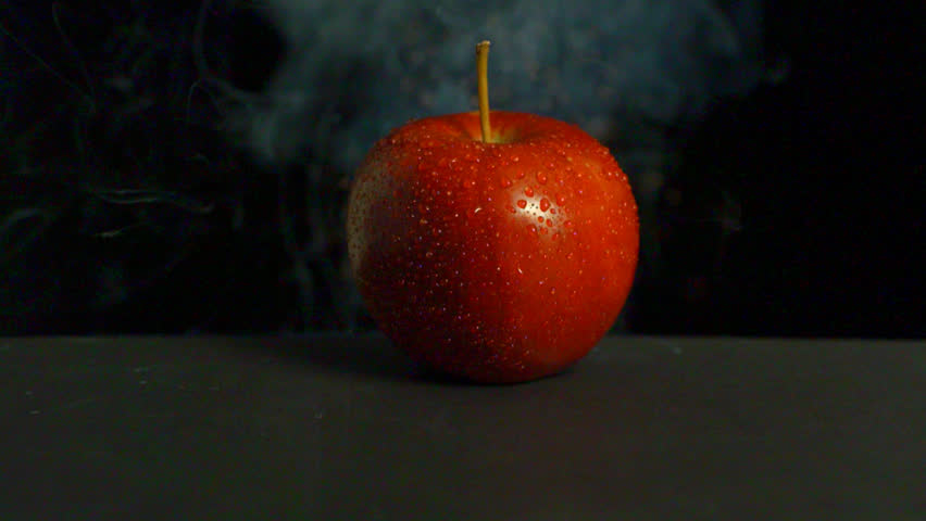 An apple exploding, close-up. Royalty-Free Stock Footage #2516309