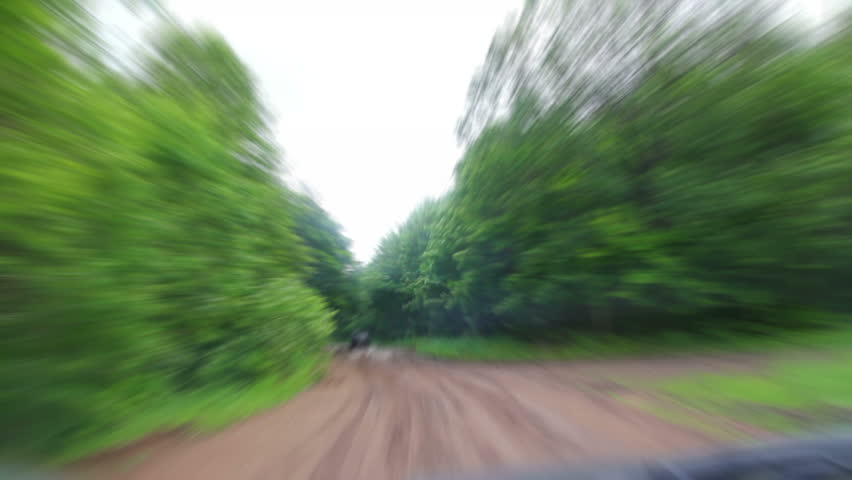 Riding on muddy forest road - timelapse
