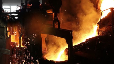 Liquid metal in the foundry, melting iron in furnace, steel mill