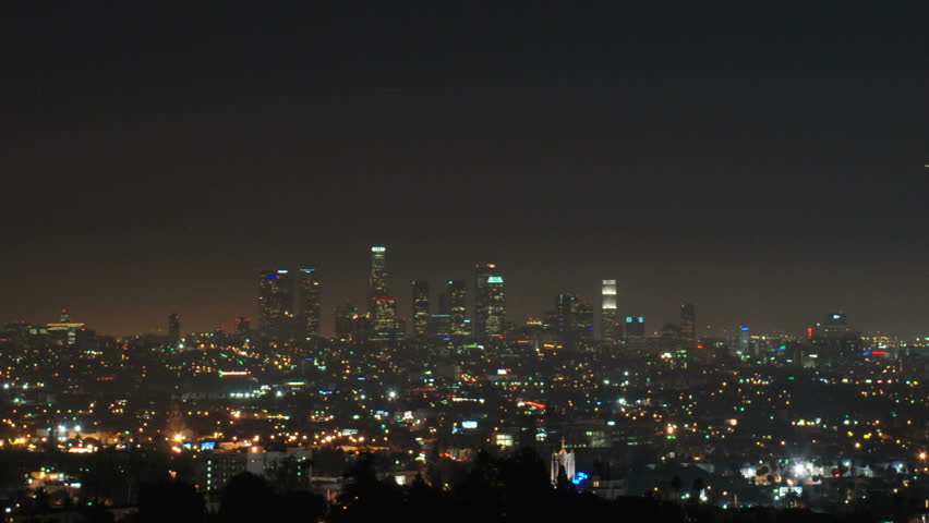 This is a time-lapse shot that tilts down from the moon to downtown Los Angeles