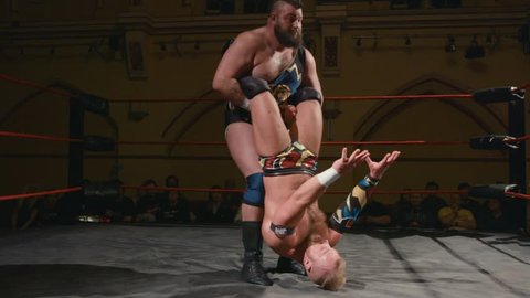 Pro Wrestling Match: Wrestler Thrown into Corner (slow motion) 