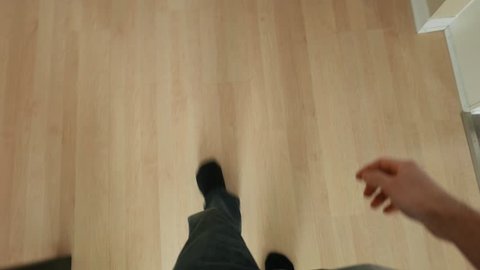 (POV) Point of view shot. Walking in a house and suddenly falling on the ground fainting away.