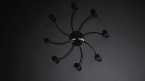 Camera shoots the chandelier from below with black white live coverage. Video full hd.