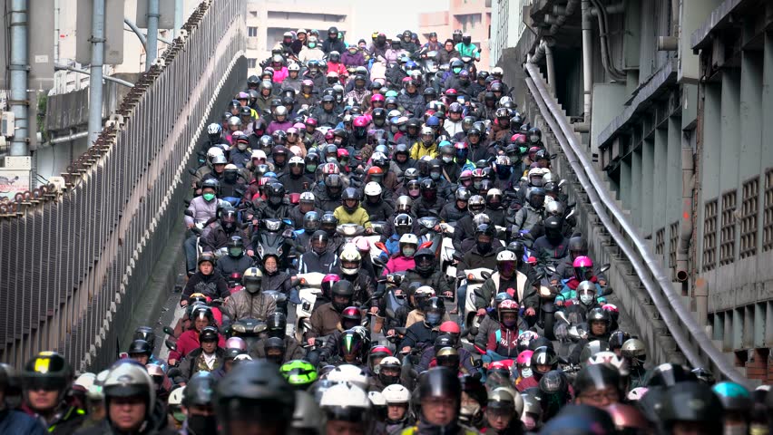 Traffic on the bridge through Taipei.city Crowed of people are riding scooters Royalty-Free Stock Footage #25178303