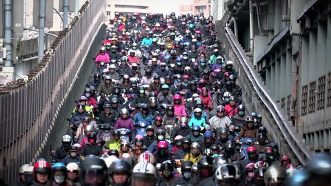 Traffic on the bridge through Taipei.city Crowed of people are riding scooters
