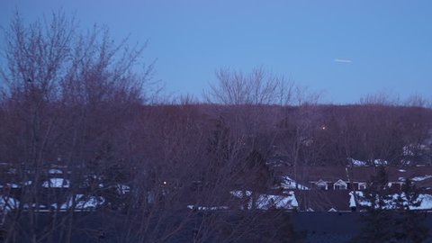 DAY TO NIGHT TIME-LAPSE: Canadian Neighborhood Townhouses - Winter Sunset & Airplanes Flying Above