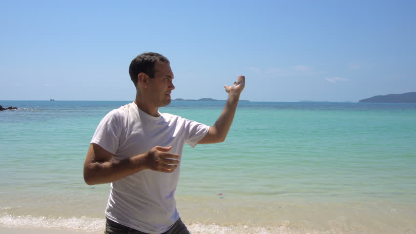 Man Practicing Self-defense by the Sea