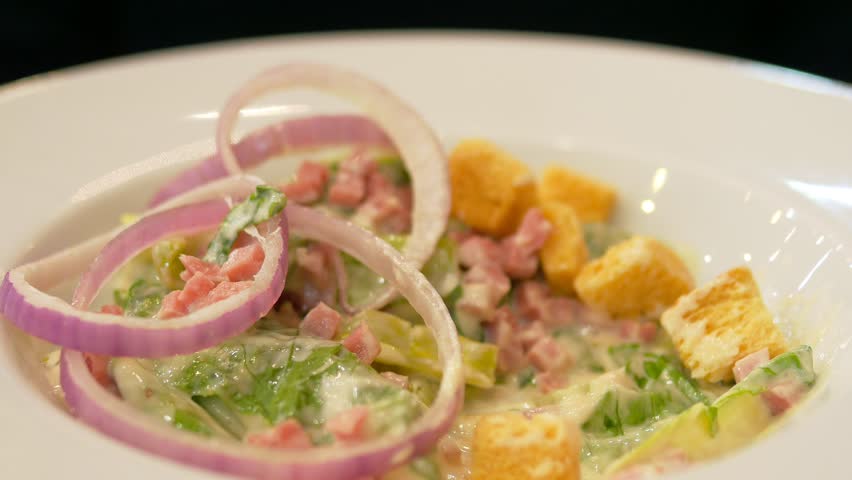 People eating Caesar salad