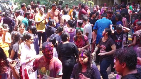 MUMBAI, INDIA - March 13, 2017: people celebrating Holi festival at Mumbai, Maharashtra, India, Southeast, Asia.