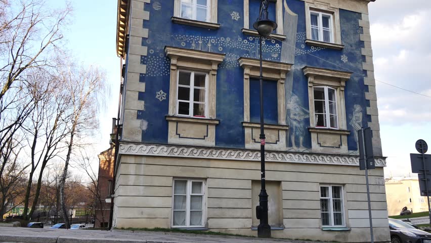 Old Town in Warsaw, capitol of Poland. March, 2017. Old tenement house with interesting painting