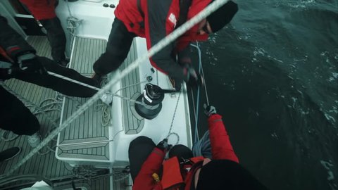 group team skipper sailing on yacht at regatta