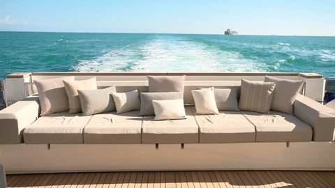 Sofas in the cockpit of a luxury yacht navigating
