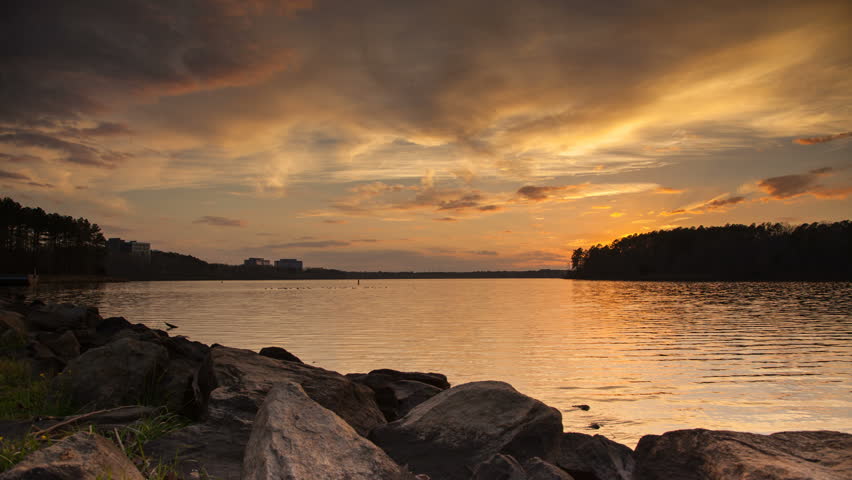 Lake Crabtree in Raleigh NC Timelapse at Dusk with Dramatic Clouds Moving Through the Sky on a Calm Evening in the Capitol of North Carolina