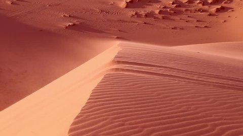 Стоковое видео: Red sand close up Sahara desert. Sunset. Sand dunes and blue sky. Beautiful desert landscape. Sahara desert. Sand dunes Arabian desert. Sand dunes wave pattern. Nature background. With sound.