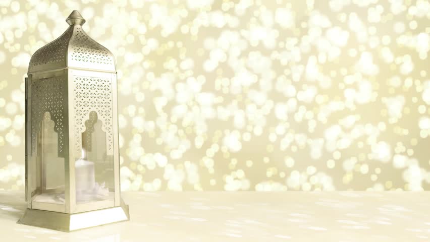 Arabic ornamental lantern with burning candle and glittering golden background with falling bokeh lights. Ramadan HD footage. Royalty-Free Stock Footage #25219367