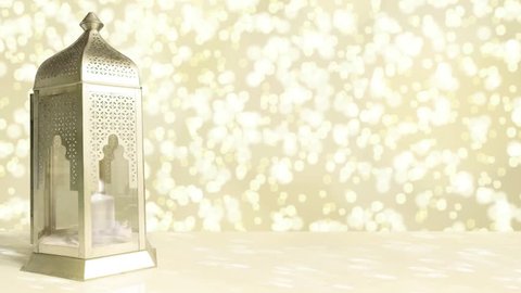 Arabic ornamental lantern with burning candle and glittering golden background with falling bokeh lights. Ramadan HD footage.
