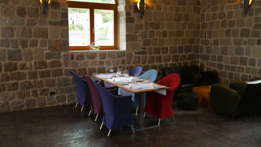 Candles on the table in the restaurant. Table setting in a cafe. Romantic dinner.