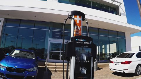 SCOTTSDALE AZ/USA: February 28, 2017- Tilt shot of an electric vehicle charging station in Scottsdale Arizona. A charging station is seen close up at a car dealership.