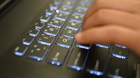 playing on computer games of hands with keyboards.