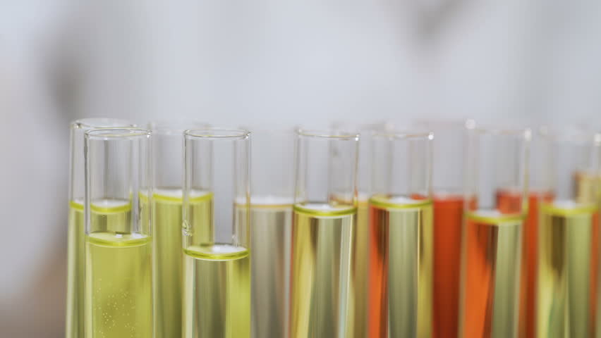 Biochemical investigation, scientist dropping serum in glass tubes, cosmetology | Shutterstock HD Video #25240202