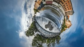 Tiny Little Planet 360 Degree Timelapse. Old City Dam, Its Water Flows, River Across the City. Threat of Water Pollution. Opole Venice in Sunny Day, Beautiful Cityscape, Vintage Buildings,