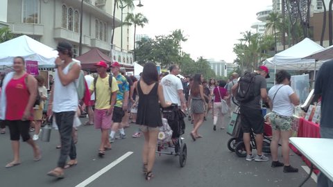 HONOLULU, HI, USA - FEBRUARY 19, 2017: Motion footage of the Waikiki weekend street festival and fair shot with a motion video stabilized camera