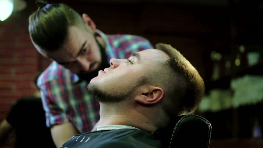 Barber Cuts the Hair in the Barbershop. Slow Motion. Close Up | Shutterstock HD Video #25274126