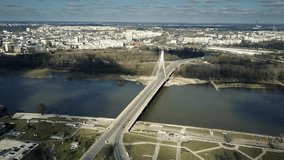 Aerial shot of Vistula river and cable bridge in Warsaw, Poland. 4K clip