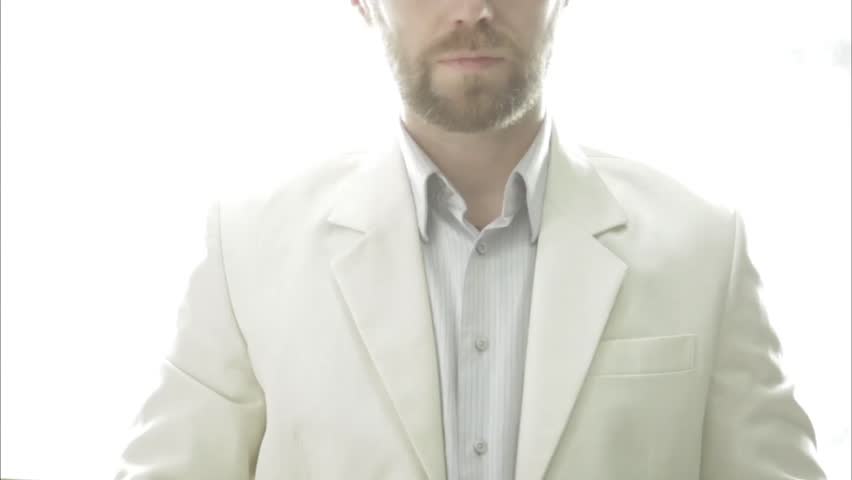 man as an angel reaches out hand and gestures to come with him into the light. afterlife relogion concept