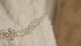 Bride's dress, close-up. Details of the wedding dress of the bride.