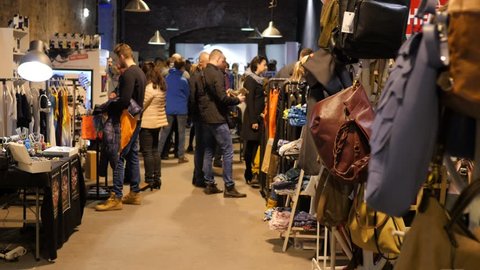 WROCLAW, POLAND - MAR 26, 2017: Free fashion festival of designer clothing. Shopping Of Designer Clothing People Walk Watch And Choose Clothes And Accessories