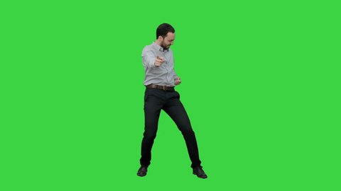 Happy man performing dance on a Green Screen, Chroma Key.