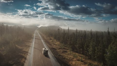 aerial of rv driving on icefields parkway in jasper